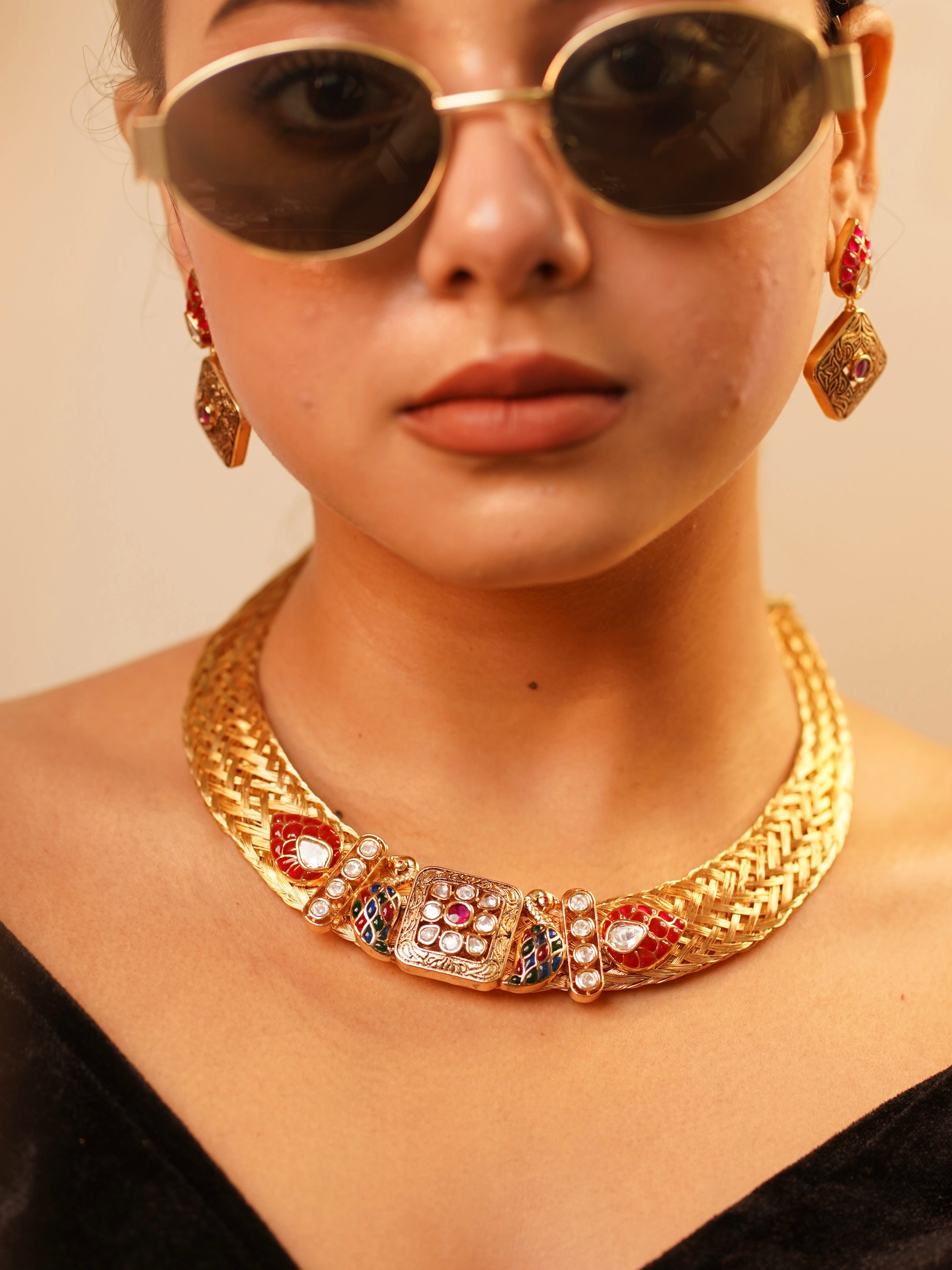 Full set view of sapphire-inspired mesh necklace and matching earring set